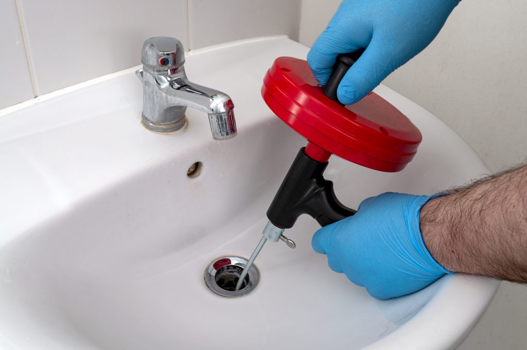 how-to-use-a-drain-snake-terry-s-plumbing